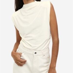 Draped top with shoulder pads